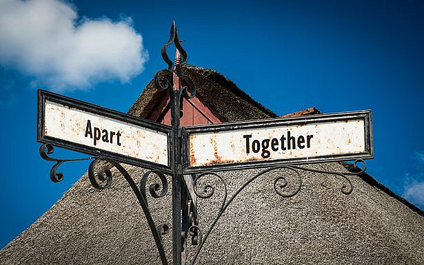 Street Sign the Direction Way to Together versus Apart